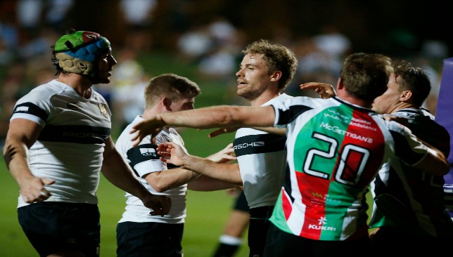 A scuffle breaks out between players during a ferocious encounter