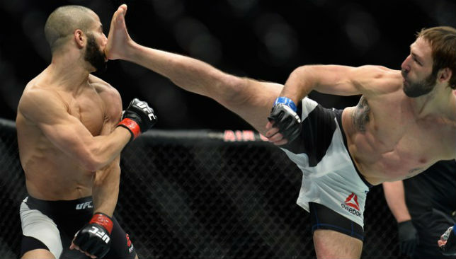 Lando Vannata kicks John Makdessi in their lightweight bout during the UFC 206.