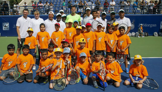 Horia Tecău with kids at the ATP Tennis Emirates Coaching Clinic