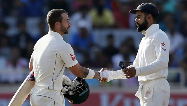 Matthew Wade and Virat Kohli shake hands after the third Test ends in a draw.