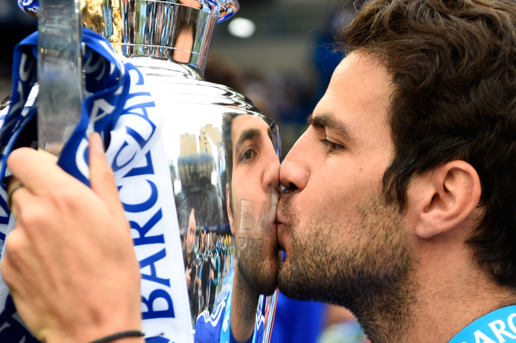 LONDON, ENGLAND - MAY 24: Cesc Fabregas of Chelsea kisses the trophy in celebration after the Barclays Premier League match between Chelsea and Sunderland at Stamford Bridge on May 24, 2015 in London, England. Chelsea were crowned Premier League champions. (Photo by Mike Hewitt/Getty Images)