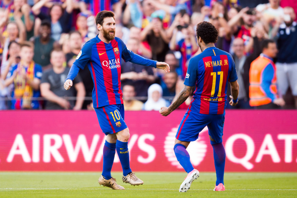 Neymar celebrates with two-goal star Messi.