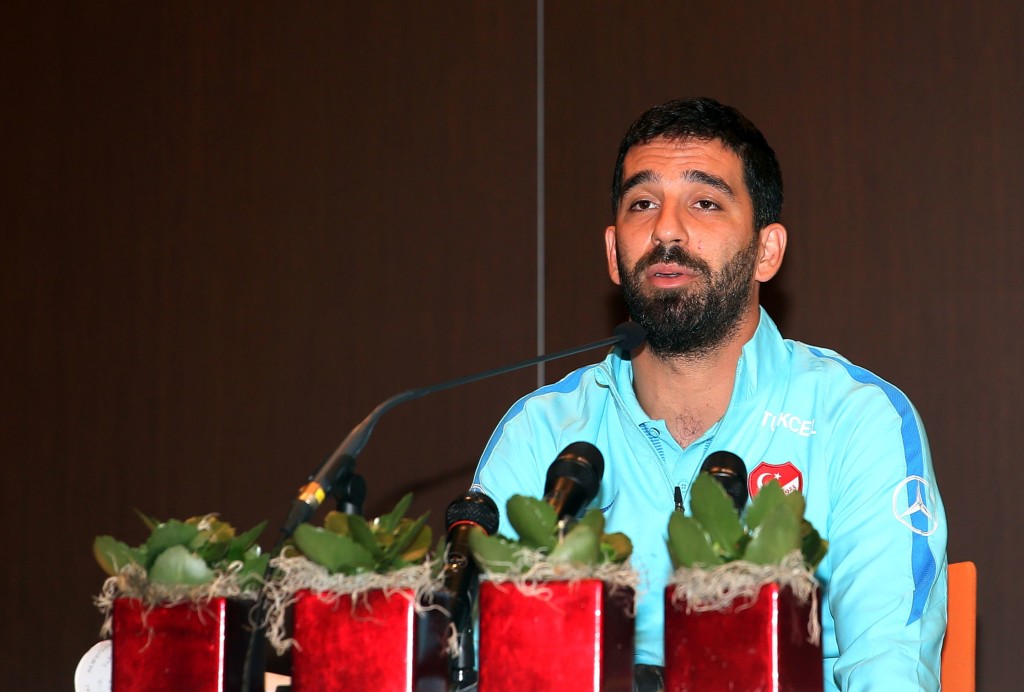 Barcelona's Turkish midfielder and Turkey's captain Arda Turan addresses a press conference announcing his retirement from international football in Portoroz, Slovenia, on June 6, 2017. Turan announced his retirement from international football on Tuesday, hours after being kicked out of a training camp by coach Fatih Terim for allegedly verbally and physically abusing a journalist. Turan had been told to leave the Turkey team's camp in Slovenia where they are preparing for a 2018 World Cup qualifier against Kosovo on June 11, the daily Hürriyet and news channel NTV earlier reported. / AFP PHOTO / STR (Photo credit should read STR/AFP/Getty Images)