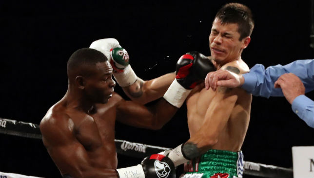  Guillermo Rigondeaux (L) and Moises Flores battle it out during their super bantamweight championship bout.