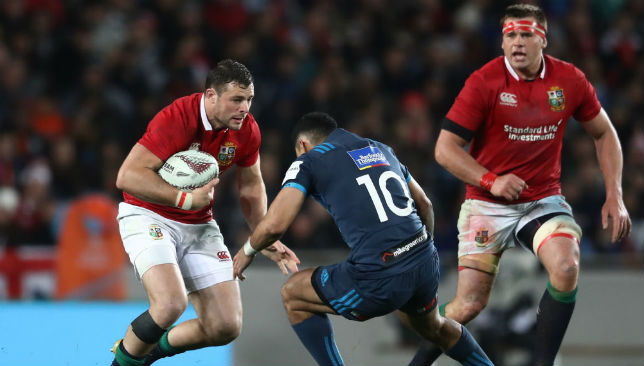 Robbie Henshaw of the British & Irish Lions charges towards Stephen Perofeta of the Blues.