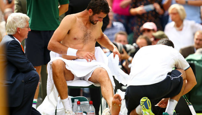 Marin Cilic is given treatment during the final against Roger Federer.