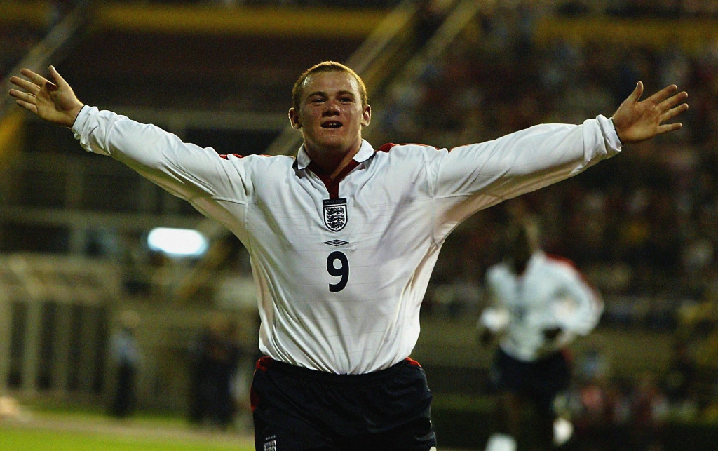 Wayne Rooney of England celebrates scoring and becoming England's youngest ever goal scorer
