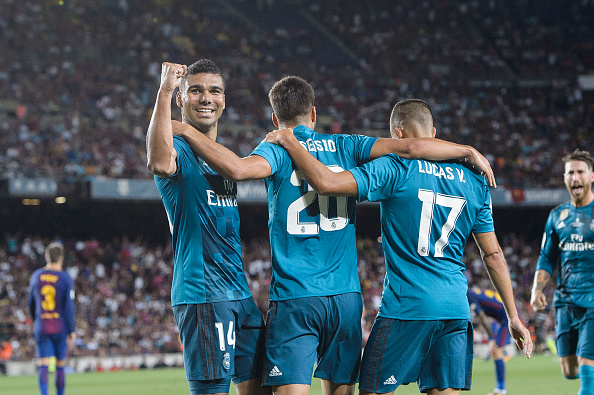Marco Asensio with Lucas Vazquez (R) and Carlos Casemiro 