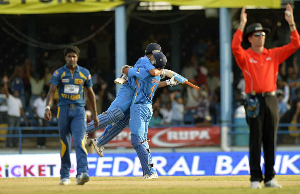 Dhoni is lifted by Ishant Sharma after pulling off stunning escape.