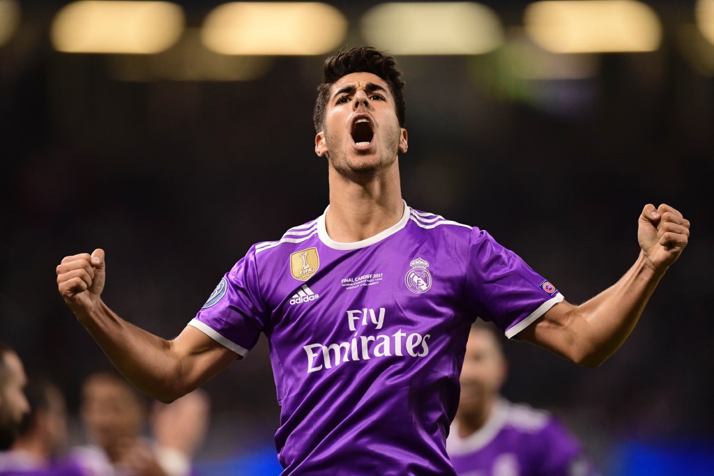 TOPSHOT - Real Madrid's Spanish midfielder Marco Asensio celebrates after scoring their fourth goal during the UEFA Champions League final football match between Juventus and Real Madrid at The Principality Stadium in Cardiff, south Wales, on June 3, 2017. / AFP PHOTO / JAVIER SORIANO (Photo credit should read JAVIER SORIANO/AFP/Getty Images)