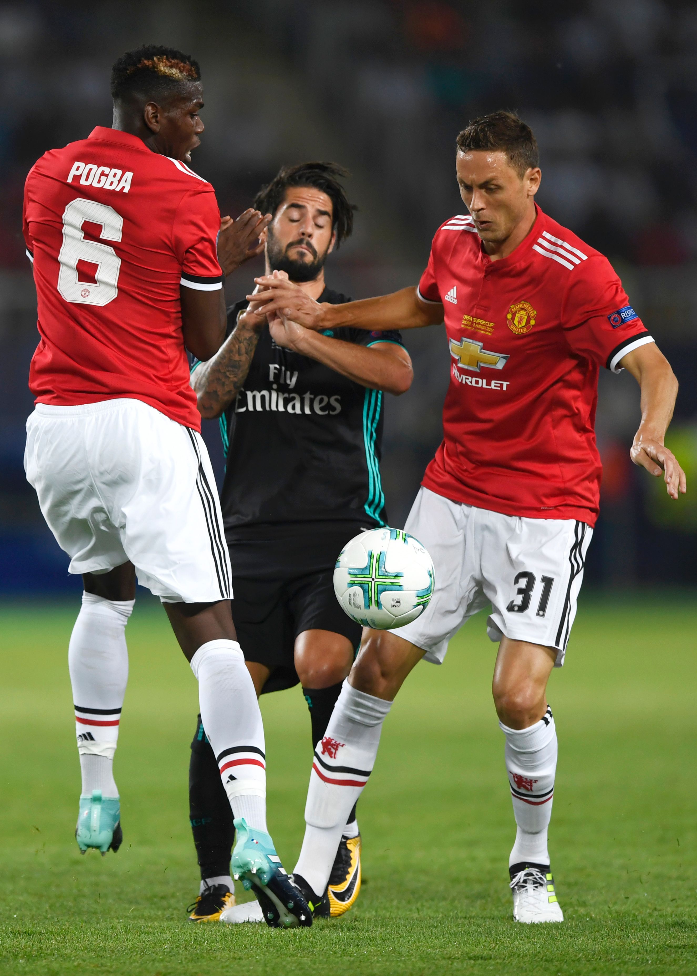 Real Madrid's Spanish midfielder Isco (C) vies with Manchester United's Serbian midfielder Nemanja Matic (R) and Manchester United's French midfielder Paul Pogba during the UEFA Super Cup football match between Real Madrid and Manchester United on August 8, 2017, at the Philip II Arena in Skopje. / AFP PHOTO / Dimitar DILKOFF (Photo credit should read DIMITAR DILKOFF/AFP/Getty Images)