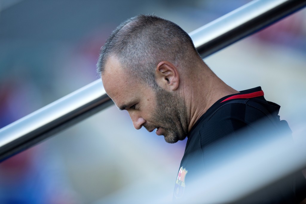 Barcelona's midfielder Andres Iniesta looks down during a training session at the Sports Center FC Barcelona Joan Gamper in Sant Joan Despi, near Barcelona on August 12, 2017 on the eve of the team's Spanish Supercup first leg football match FC Barcelona vs Real Madrid. / AFP PHOTO / Josep LAGO (Photo credit should read JOSEP LAGO/AFP/Getty Images)