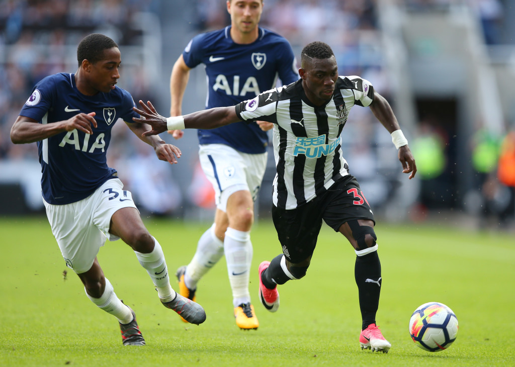 NEWCASTLE UPON TYNE, ENGLAND - AUGUST 13: Christian Atsu of Newcastle United and Kyle Walker-Peters of Tottenham Hotspur battle for possession during the Premier League match between Newcastle United and Tottenham Hotspur at St. James Park on August 13, 2017 in Newcastle upon Tyne, England. (Photo by Alex Livesey/Getty Images)