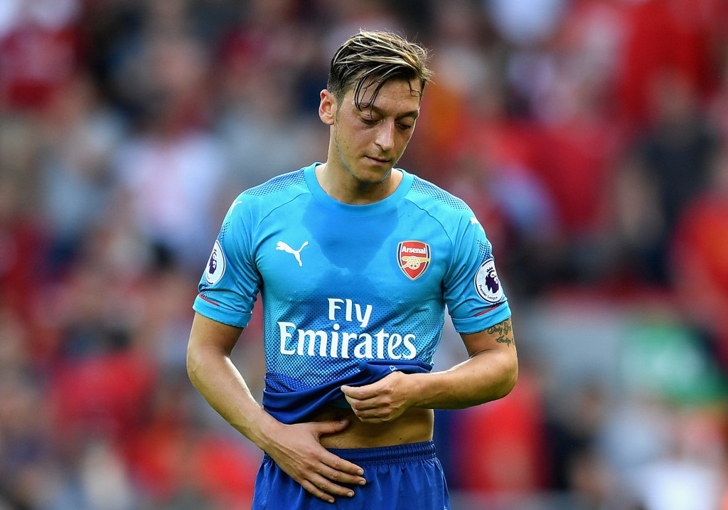 Mesut Ozil looks dejected during the defeat to Liverpool