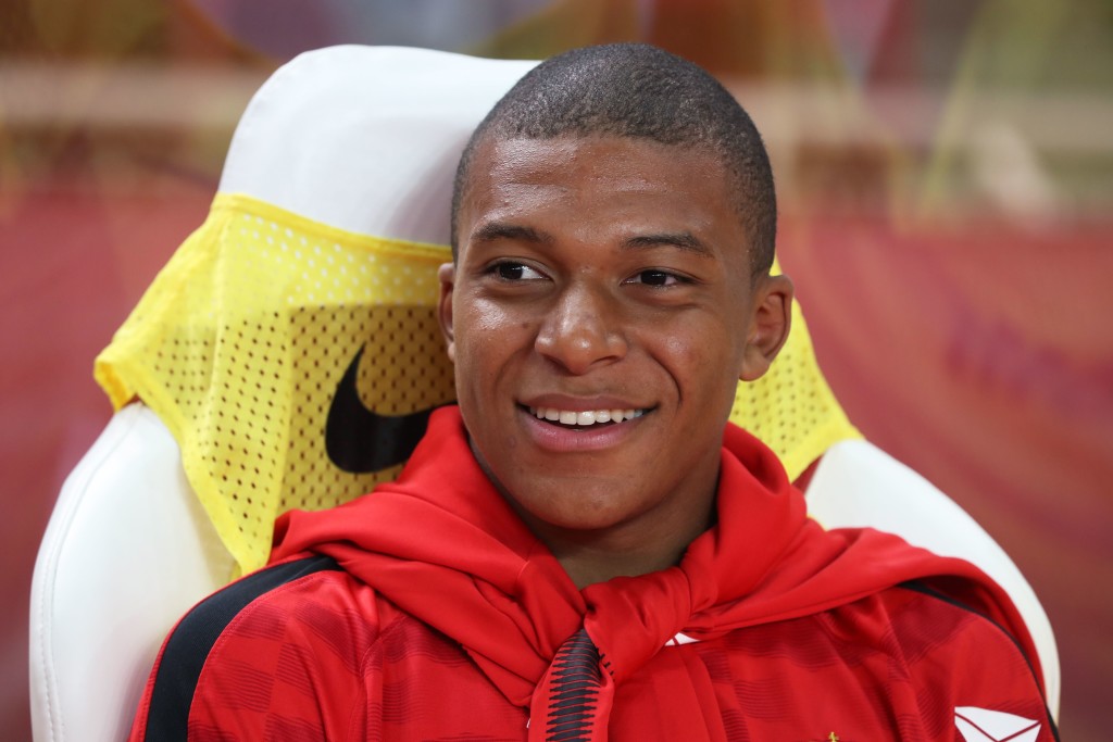 Monaco's French forward Kylian Mbappe sits on the bench at the start of the French L1 football match between Monaco (ASM) and Marseille (OM) on August 27, 2017, at the Louis II Stadium in Monaco. / AFP PHOTO / Valery HACHE (Photo credit should read VALERY HACHE/AFP/Getty Images)