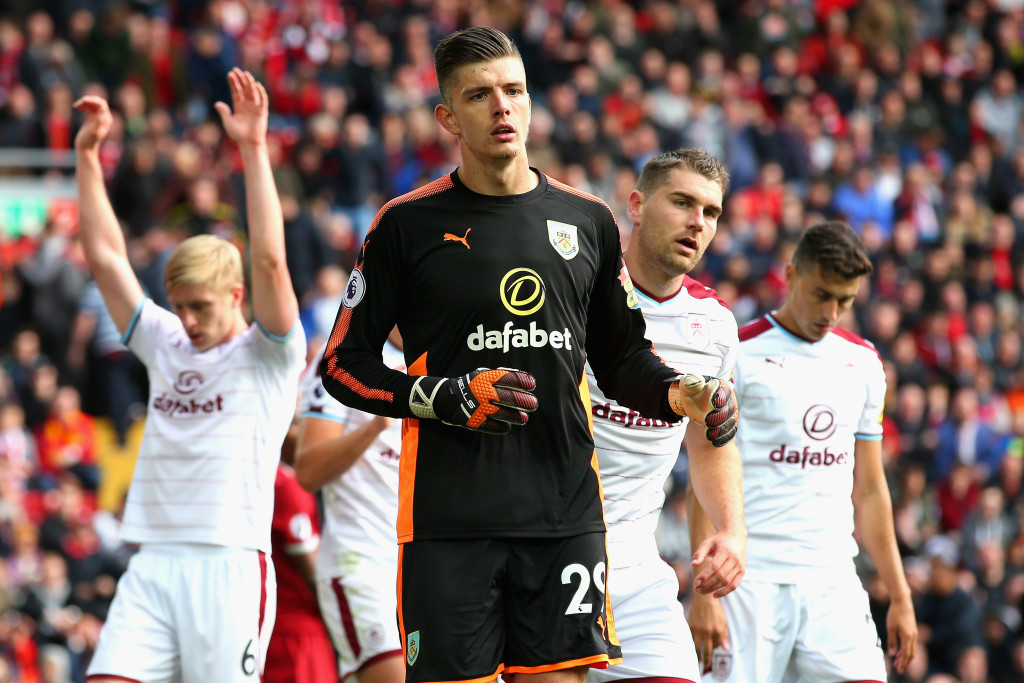 Burnley defended heroically to earn their first Premier League point at Anfield.
