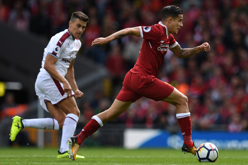 Philippe Coutinho sprints away from Matthew Lowton 