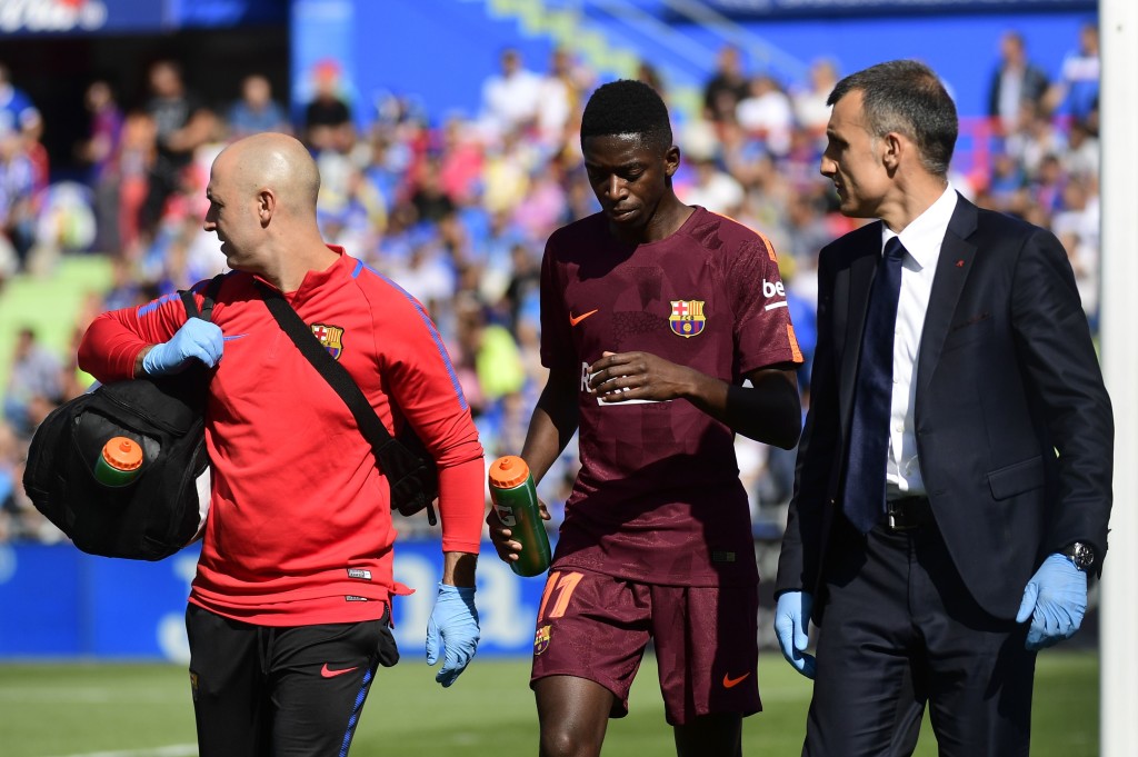 Ousmane Dembele trudges off with a hamstring injury