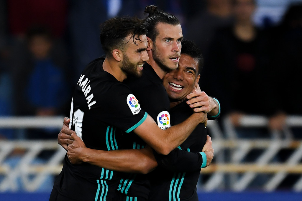 SAN SEBASTIAN, SPAIN - SEPTEMBER 17: Gareth Bale of Real Madrid CF (C) celebrates with his team mates Borja Mayoral (L) and Carlos Enrique Casimiro after scoring his team's third goal during the La Liga match between Real Sociedad and Real Madrid at Anoeta stadium on September 17, 2017 in San Sebastian, Spain. (Photo by David Ramos/Getty Images)