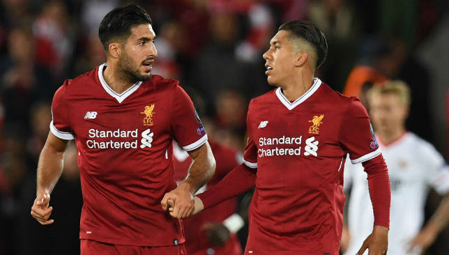 Roberto Firmino (R) and Emre Can.