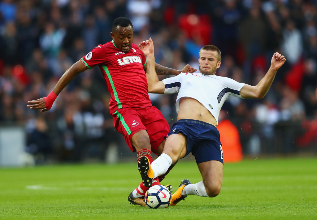 LONDON, ENGLAND - SEPTEMBER 16: Jordan Ayew of Swansea City and Eric Dier of Tottenham Hotspur battle for possession during the Premier League match between Tottenham Hotspur and Swansea City at Wembley Stadium on September 16, 2017 in London, England. (Photo by Clive Rose/Getty Images)
