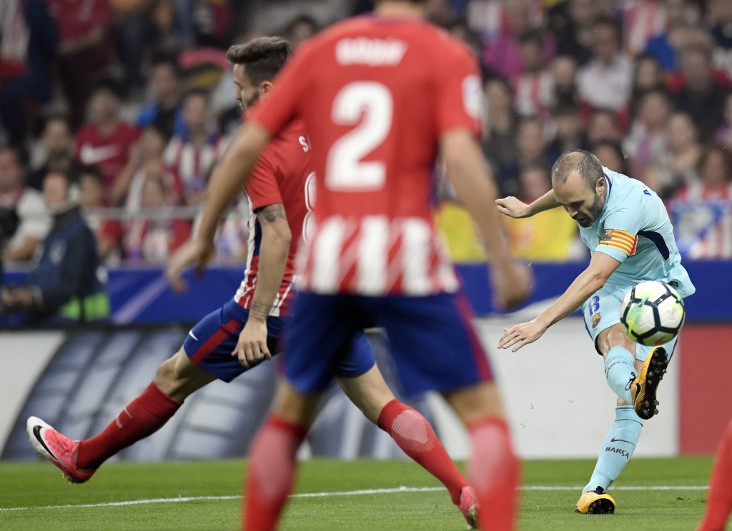 Andres Iniesta shoots during the draw with Atletico Madrid