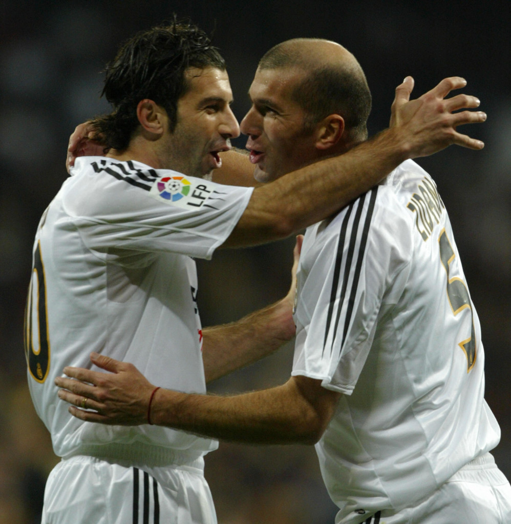 MADRID, SPAIN: Real Madrid French Zinedine Zidane (R) celebrates his goal against Albacete with teammate Portuguese Luis Figo (L) during a Premier League football match in Santiago Bernabeu stadium in Madrid 14 November 2004. AFP PHOTO/ Pierre-Philippe MARCOU (Photo credit should read PIERRE-PHILIPPE MARCOU/AFP/Getty Images)