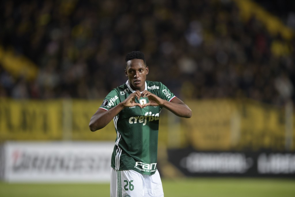 Brazil's Palmeiras player Yerry Mina celebrates after scoring a goal against Uruguay's Penarol during their Libertadores Cup football match at the Campeones del Siglo Stadium in Montevideo on April 26, 2017. / AFP PHOTO / MIGUEL ROJO (Photo credit should read MIGUEL ROJO/AFP/Getty Images)