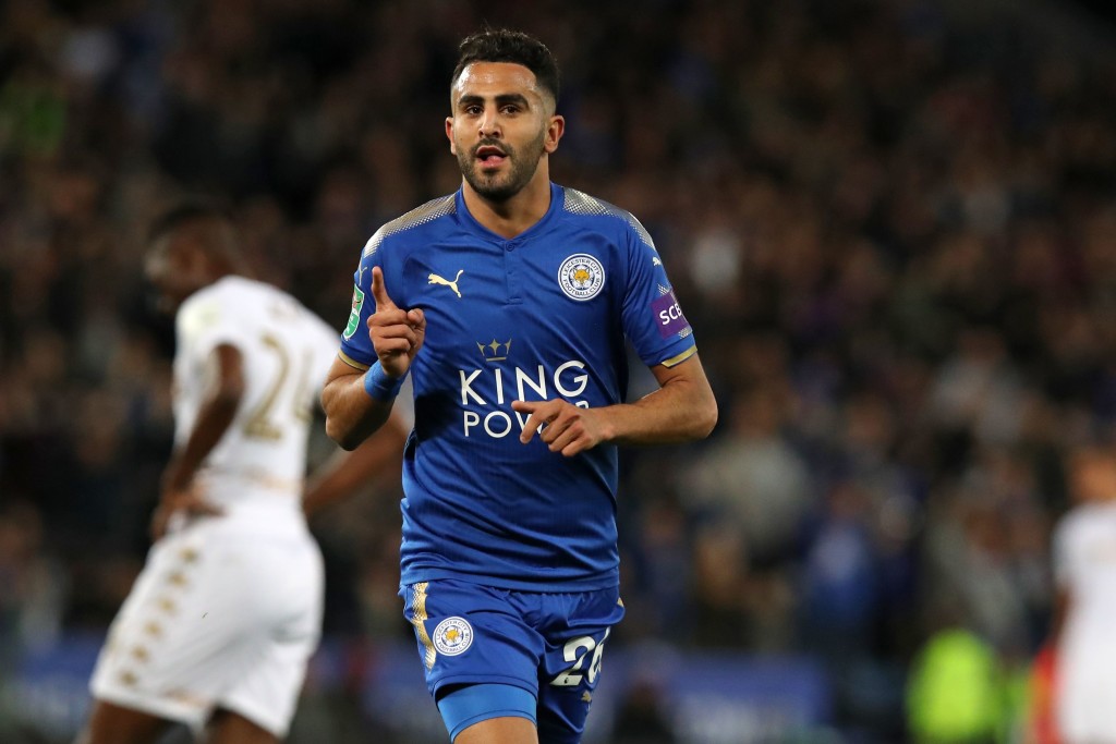 Leicester City's Algerian midfielder Riyad Mahrez celebrates after scoring their third goal during the English League Cup fourth round football match between Leicester City and Leeds United at King Power Stadium in Leicester, central England on October 24, 2017. Leicester won the game 3-1. / AFP PHOTO / Lindsey PARNABY / RESTRICTED TO EDITORIAL USE. No use with unauthorized audio, video, data, fixture lists, club/league logos or 'live' services. Online in-match use limited to 75 images, no video emulation. No use in betting, games or single club/league/player publications. / (Photo credit should read LINDSEY PARNABY/AFP/Getty Images)