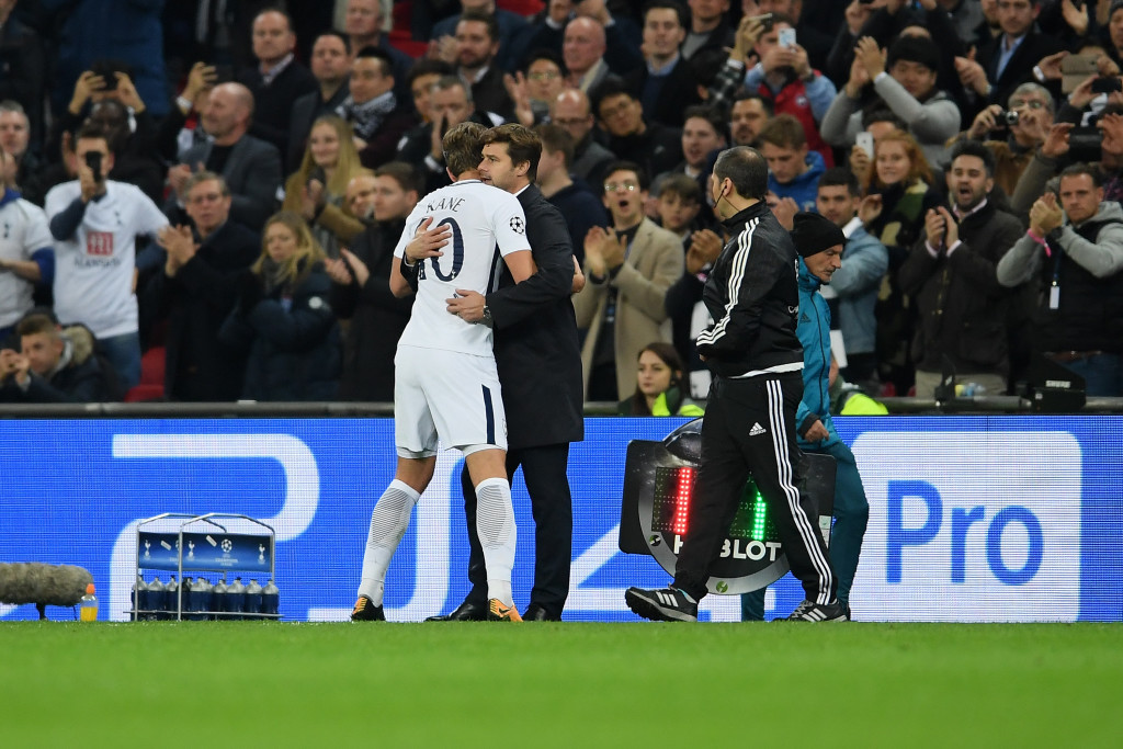 Kane embraces Pochettino during the win over Madrid 
