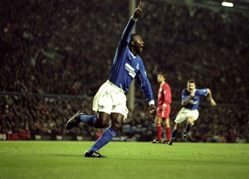Campbell celebrates scoring against Liverpool in 1999