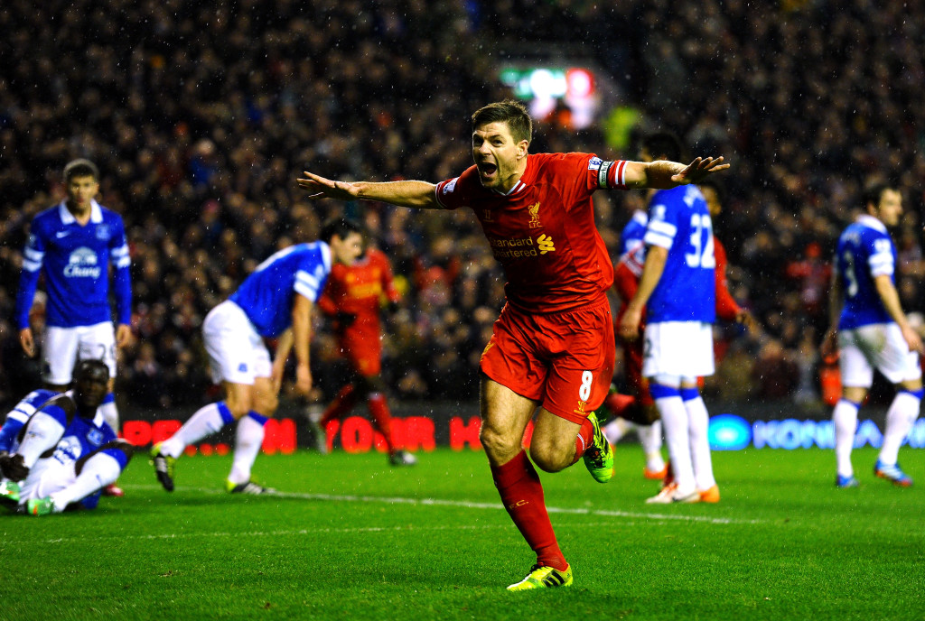 LIVERPOOL, ENGLAND - JANUARY 28: Steven Gerrard of Liverpool celebrates after scoring the opening goal during the Barclays Premier League match between Liverpool and Everton at Anfield on January 28, 2014 in Liverpool, England. (Photo by Laurence Griffiths/Getty Images)