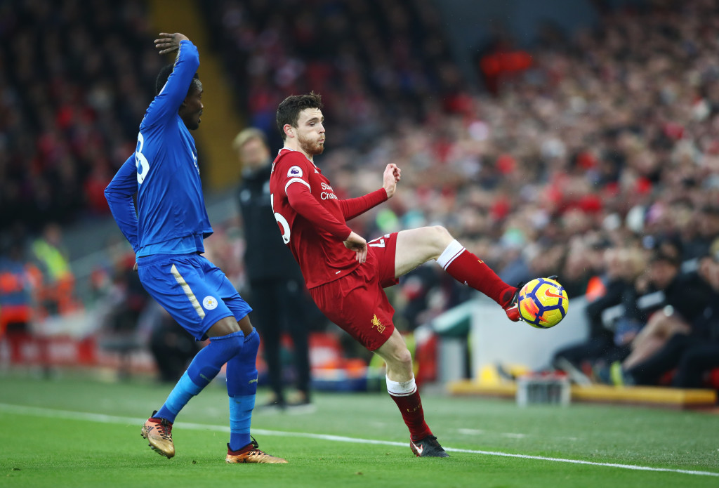 Andy Robertson is closed down by Daniel Amartey 