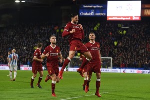 Emre Can celebrates after scoring the opening goal  against Huddersfield.
