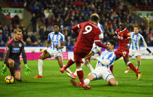 Roberto Firmino tucks home the second against the Terriers.