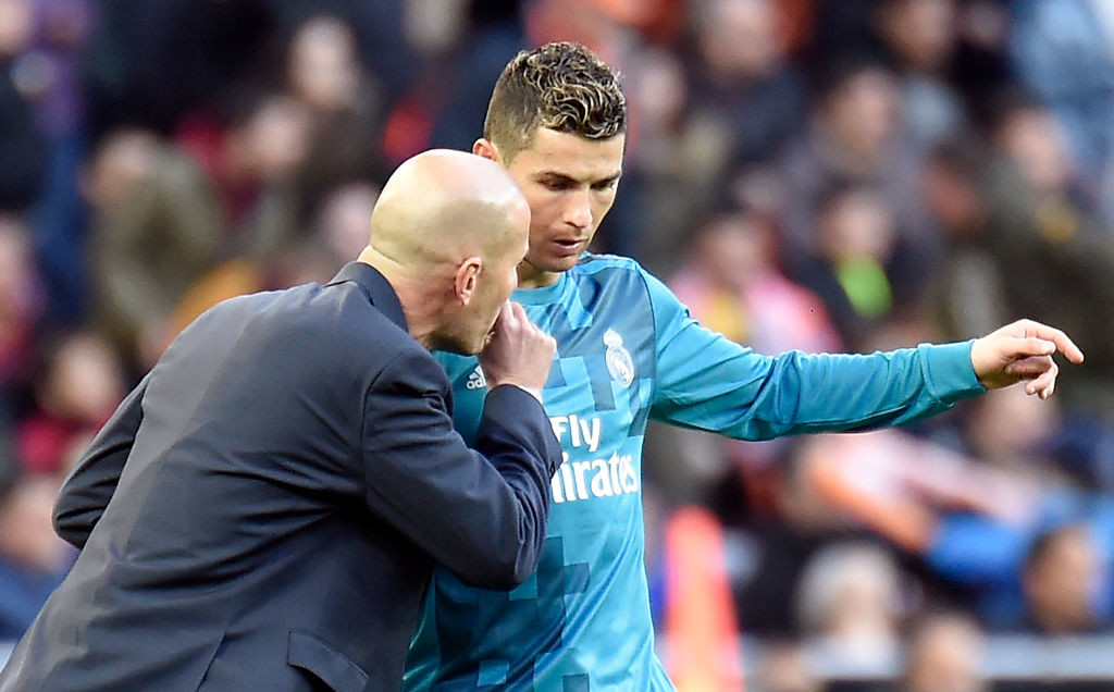 Zinedine Zidane talks to Cristiano Ronaldo