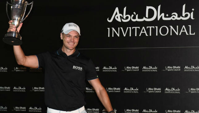 Martin Kaymer celebrates with the Abu Dhabi Invitational trophy.