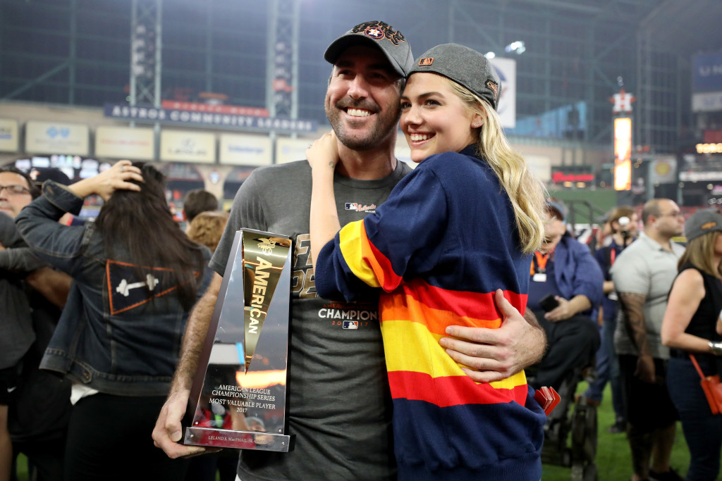 HOUSTON, TX - OCTOBER 21: Justin Verlander #35 of the Houston Astros celebrates with model Kate Upton and the MVP trophy after defeating the New York Yankees by a score of 4-0 to win Game Seven of the American League Championship Series at Minute Maid Park on October 21, 2017 in Houston, Texas. The Houston Astros advance to face the Los Angeles Dodgers in the World Series. (Photo by Ronald Martinez/Getty Images)