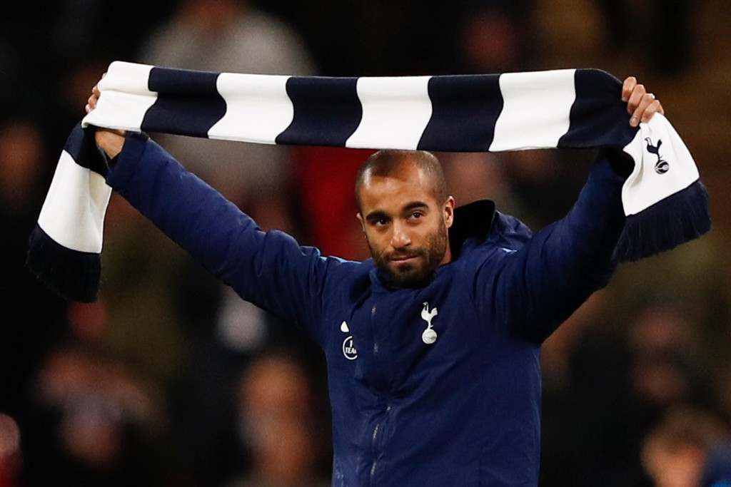 Tottenham Hotspur's new Brazil midfielder Lucas Moura gestures to fans on the pitch at half-time during the English Premier League football match between Tottenham Hotspur and Manchester United at Wembley Stadium in London, on January 31, 2018. / AFP PHOTO / Adrian DENNIS / RESTRICTED TO EDITORIAL USE. No use with unauthorized audio, video, data, fixture lists, club/league logos or 'live' services. Online in-match use limited to 75 images, no video emulation. No use in betting, games or single club/league/player publications. / (Photo credit should read ADRIAN DENNIS/AFP/Getty Images)