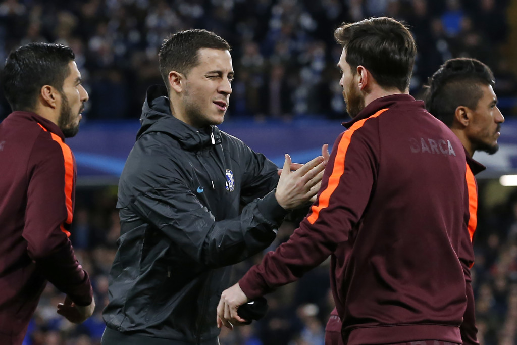 Eden hazard (c) greets Lionel Messi.
