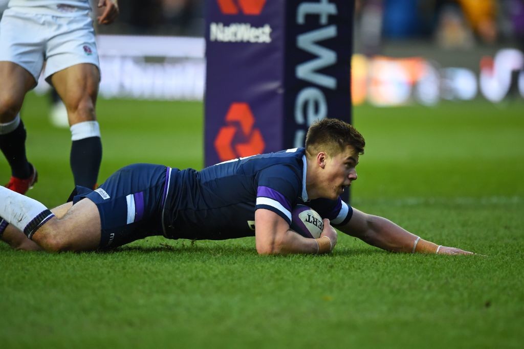 Scotland centre Huw Jones dives over for his first try