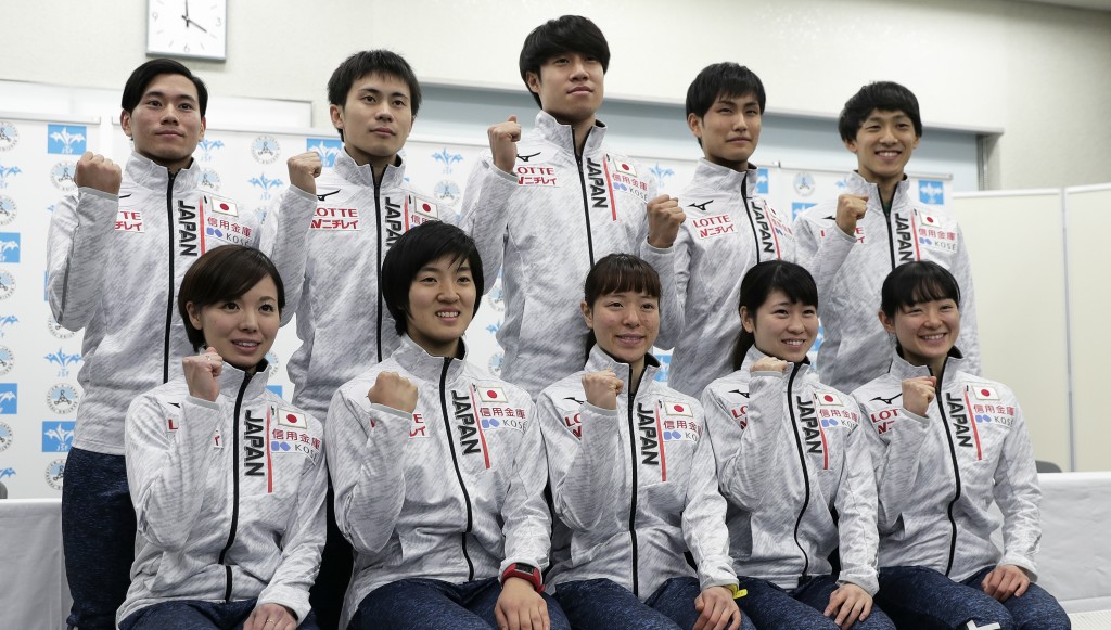 Kei Sato (top row, far l) poses with teammate after the Japan Short Track Speed Skating Team for the Winter Olympic Games is announced in December.