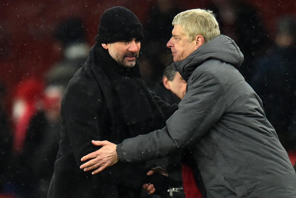 Arsene Wenger (r) and Pep Guardiola share an embrace after City's win on Thursday.