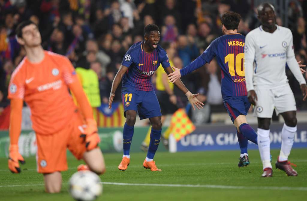 Ousmane Dembele and Lionel Messi cheer Barcelona's second goal.