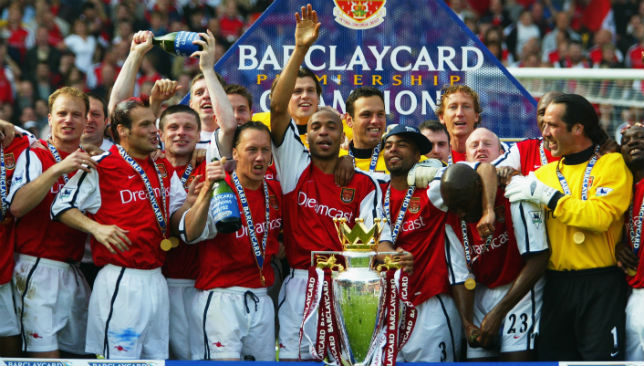 Arsenal players celebrate winning the league