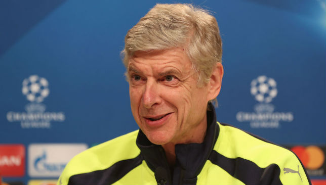 Arsene Wenger of Arsenal FC smiles