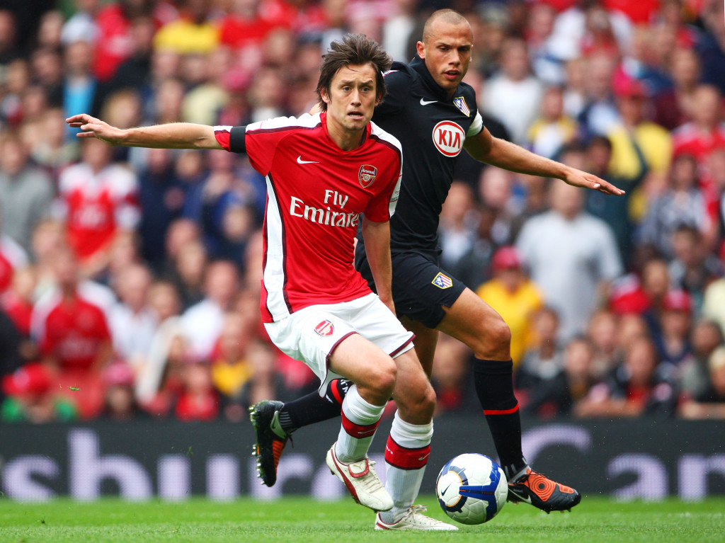 LONDON, ENGLAND - AUGUST 01: Tomas Rosicky of Arsenal is challenged by John Heitinga of Athletico during the Emirates Cup match between Arsenal and Athletico Madrid at the Emirates Stadium on August 1, 2009 in London, England. (Photo by Phil Cole/Getty Images)