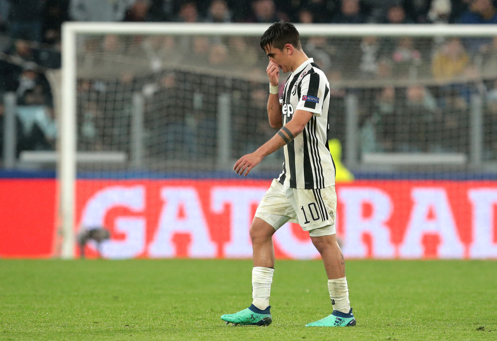 Paulo Dybala of Juventus walks off after being sent off.