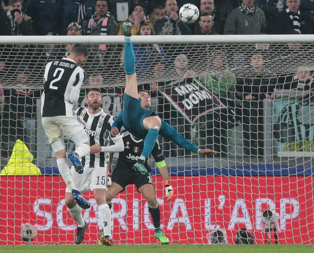 TURIN, ITALY - APRIL 03: Cristiano Ronaldo of Real Madrid scores his sides second goal during the UEFA Champions League Quarter Final Leg One match between Juventus and Real Madrid at Allianz Stadium on April 3, 2018 in Turin, Italy. (Photo by Emilio Andreoli/Getty Images)