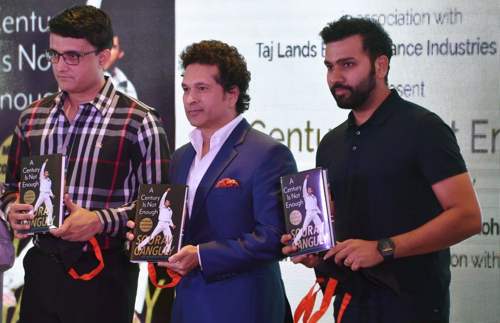 The trio poses with Ganguly's autobiography.